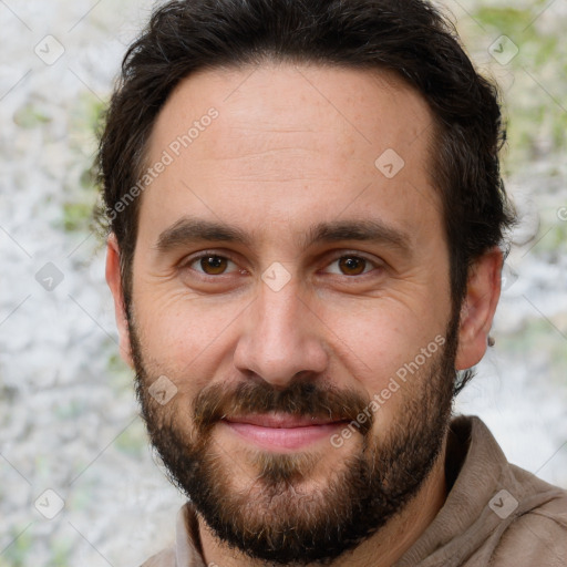 Joyful white adult male with short  brown hair and brown eyes