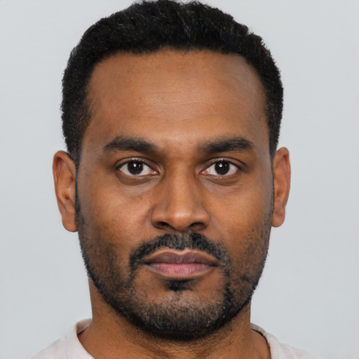 Neutral black young-adult male with short  black hair and brown eyes