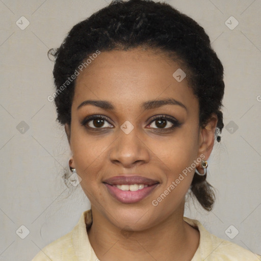 Joyful black young-adult female with short  black hair and brown eyes