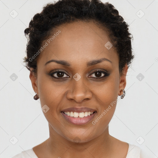 Joyful black young-adult female with short  black hair and brown eyes