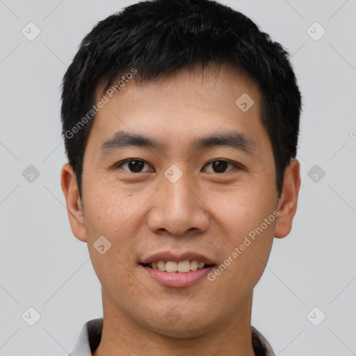 Joyful asian young-adult male with short  black hair and brown eyes