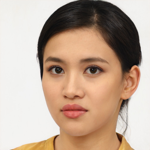 Neutral asian young-adult female with medium  brown hair and brown eyes
