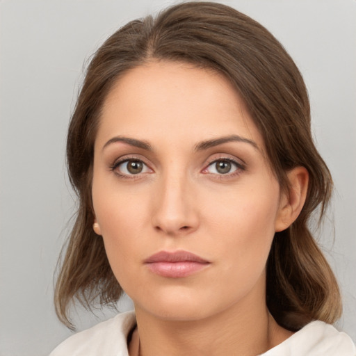 Neutral white young-adult female with medium  brown hair and brown eyes