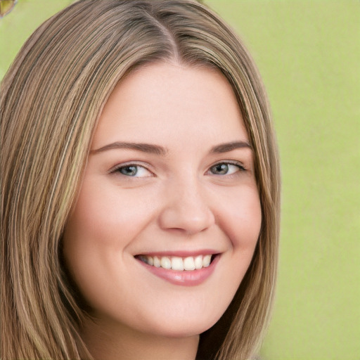 Joyful white young-adult female with long  brown hair and green eyes