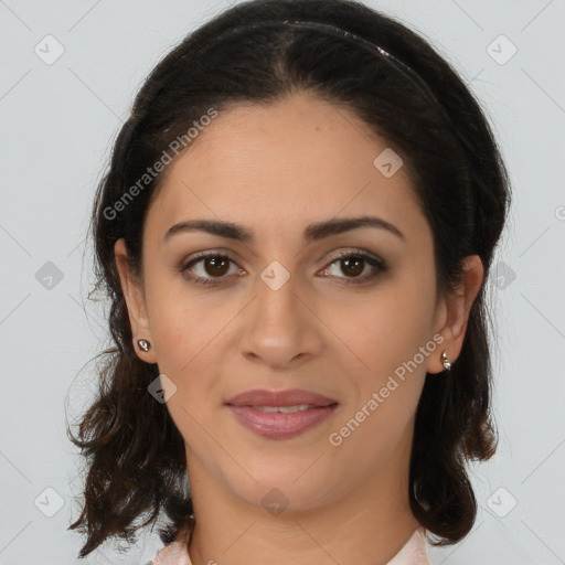 Joyful latino young-adult female with medium  brown hair and brown eyes