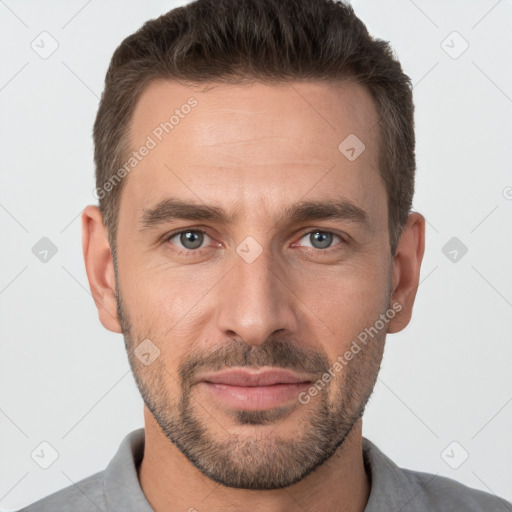 Joyful white adult male with short  brown hair and brown eyes