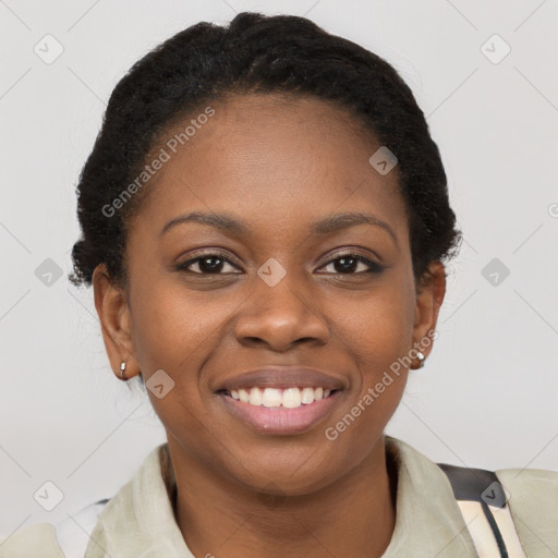 Joyful black young-adult female with short  brown hair and brown eyes