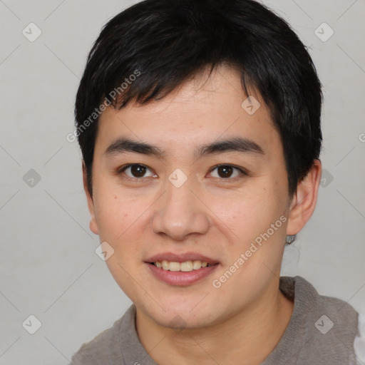 Joyful asian young-adult male with short  black hair and brown eyes