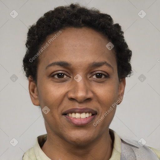 Joyful black young-adult female with short  brown hair and brown eyes