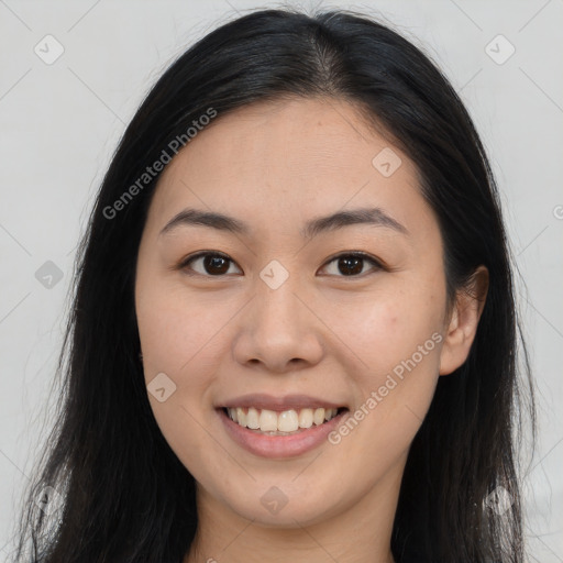 Joyful asian young-adult female with long  brown hair and brown eyes