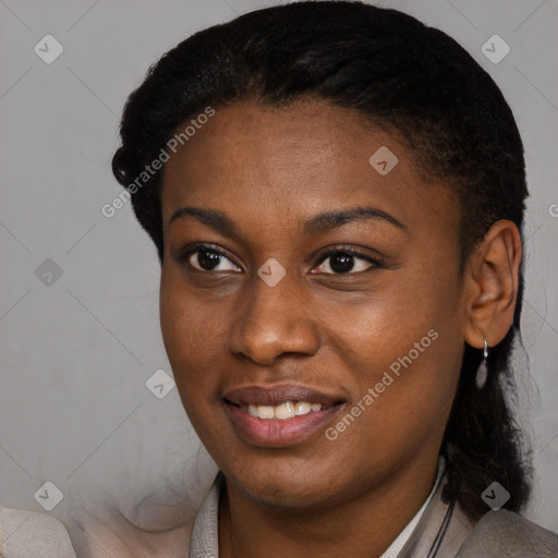 Joyful black young-adult female with short  black hair and brown eyes