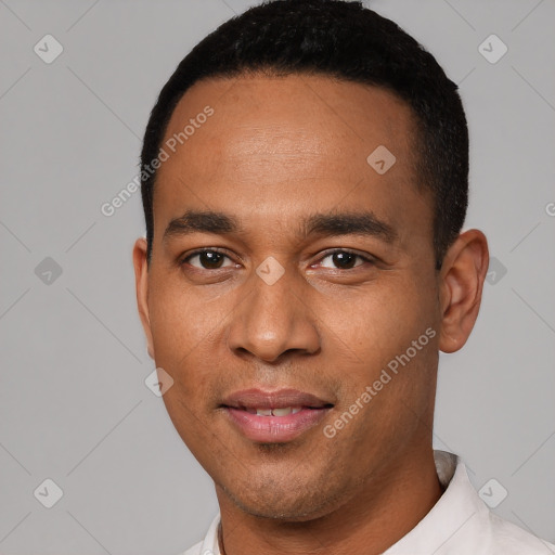 Joyful white young-adult male with short  black hair and brown eyes