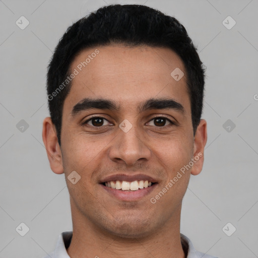 Joyful latino young-adult male with short  black hair and brown eyes