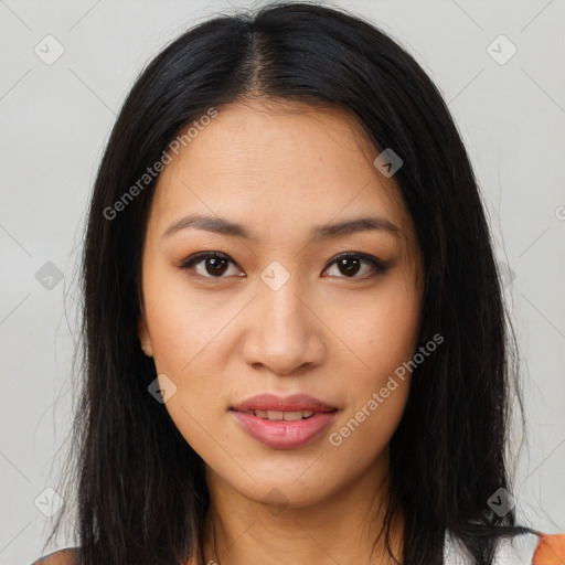 Joyful latino young-adult female with long  brown hair and brown eyes