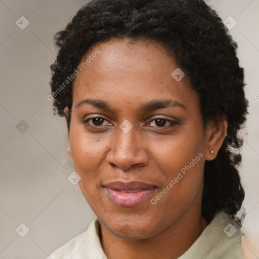 Joyful black adult female with short  brown hair and brown eyes