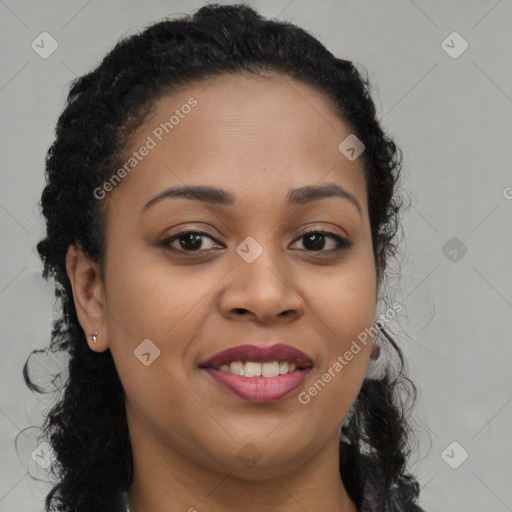 Joyful black young-adult female with long  brown hair and brown eyes