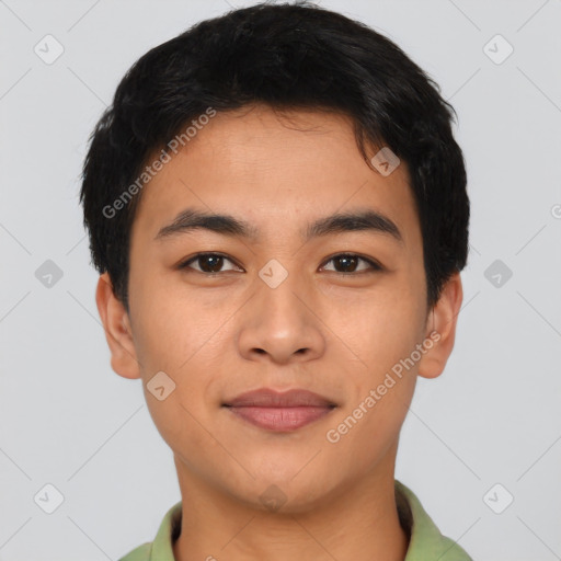 Joyful asian young-adult male with short  brown hair and brown eyes