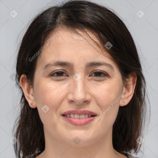 Joyful white adult female with medium  brown hair and brown eyes