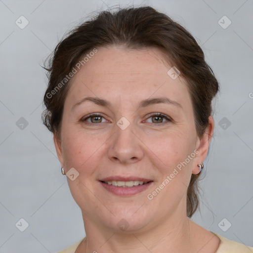 Joyful white adult female with short  brown hair and grey eyes