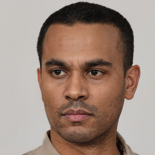 Neutral latino young-adult male with short  black hair and brown eyes