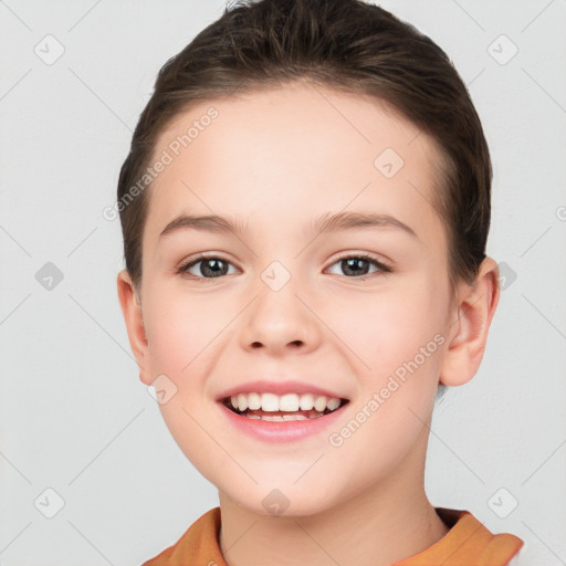 Joyful white child female with short  brown hair and brown eyes