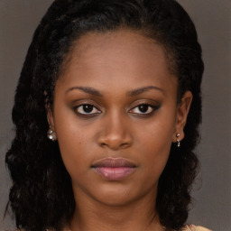 Neutral black young-adult female with long  brown hair and brown eyes