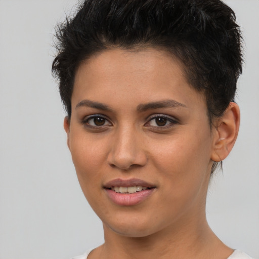 Joyful white young-adult female with short  brown hair and brown eyes