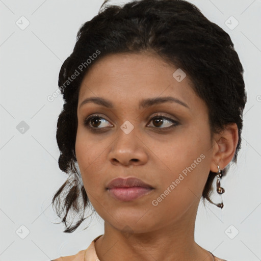 Neutral black young-adult female with medium  brown hair and brown eyes