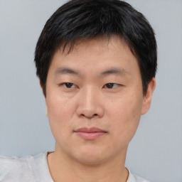 Neutral asian young-adult male with short  brown hair and brown eyes