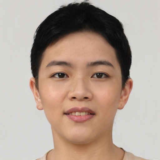 Joyful asian young-adult female with short  black hair and brown eyes