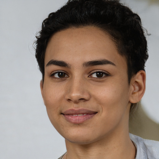 Joyful latino young-adult female with short  brown hair and brown eyes