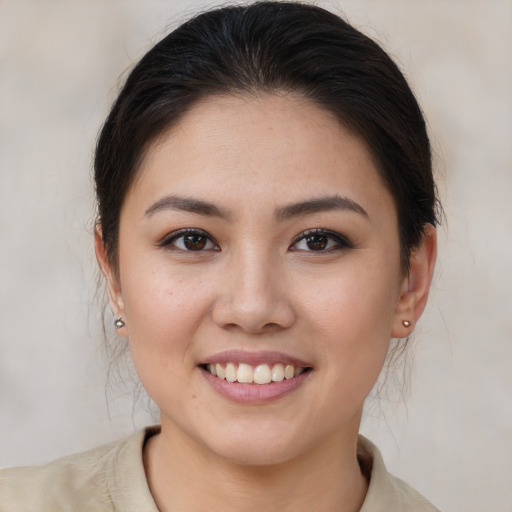 Joyful white young-adult female with medium  brown hair and brown eyes
