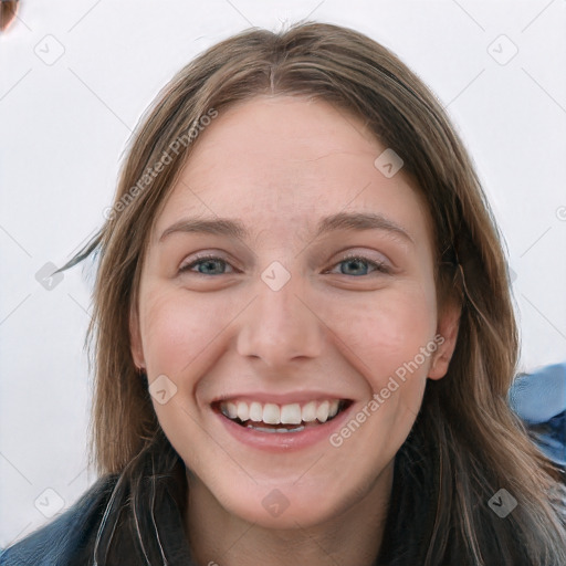 Joyful white young-adult female with long  brown hair and blue eyes