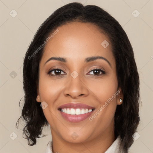 Joyful latino young-adult female with long  brown hair and brown eyes