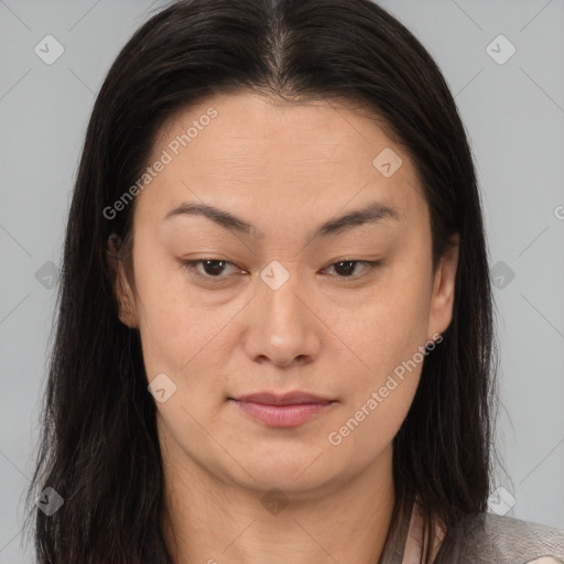 Joyful asian young-adult female with long  brown hair and brown eyes