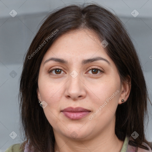 Joyful white adult female with medium  brown hair and brown eyes