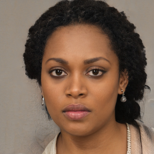 Neutral black young-adult female with long  black hair and brown eyes