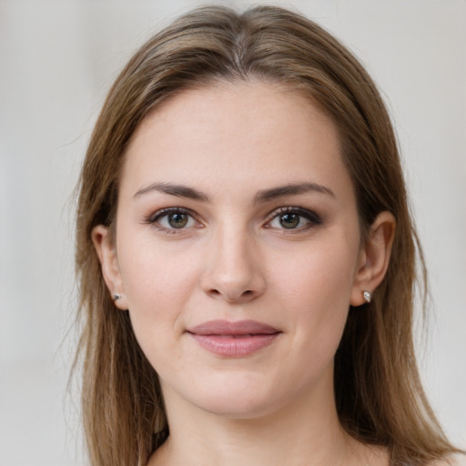 Joyful white young-adult female with long  brown hair and grey eyes