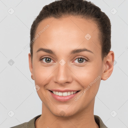 Joyful white young-adult female with short  brown hair and brown eyes