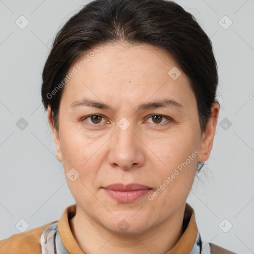 Joyful white adult female with medium  brown hair and brown eyes