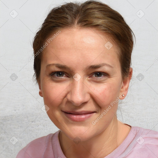 Joyful white adult female with medium  brown hair and blue eyes