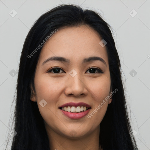 Joyful asian young-adult female with long  brown hair and brown eyes