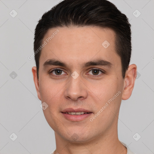 Joyful white young-adult male with short  brown hair and brown eyes