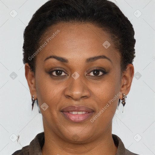 Joyful black adult female with short  brown hair and brown eyes