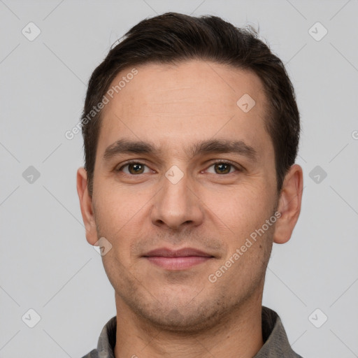 Joyful white young-adult male with short  brown hair and brown eyes