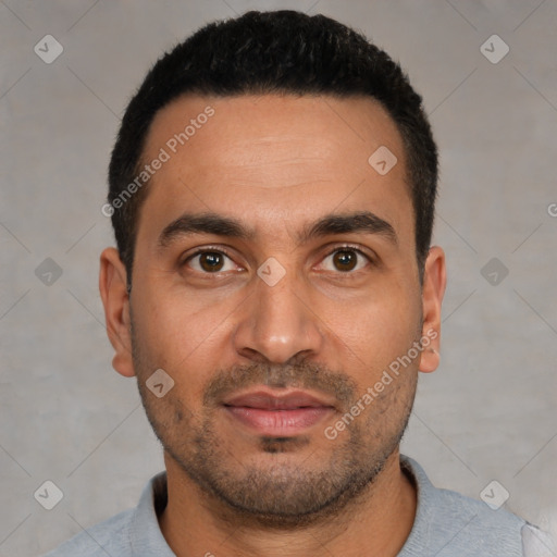 Joyful white young-adult male with short  black hair and brown eyes
