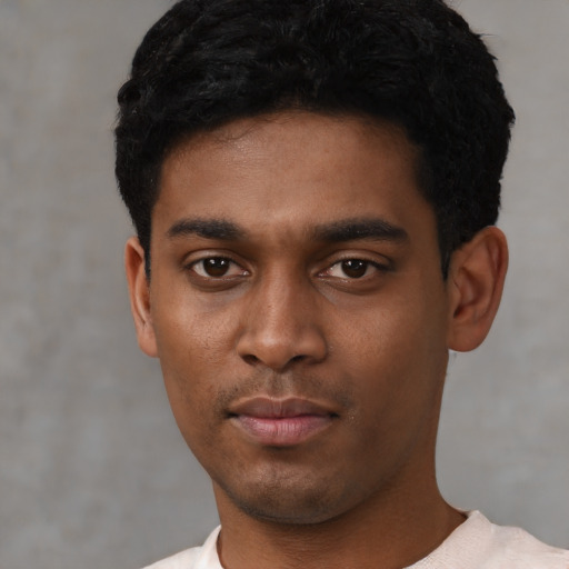 Neutral black young-adult male with short  black hair and brown eyes