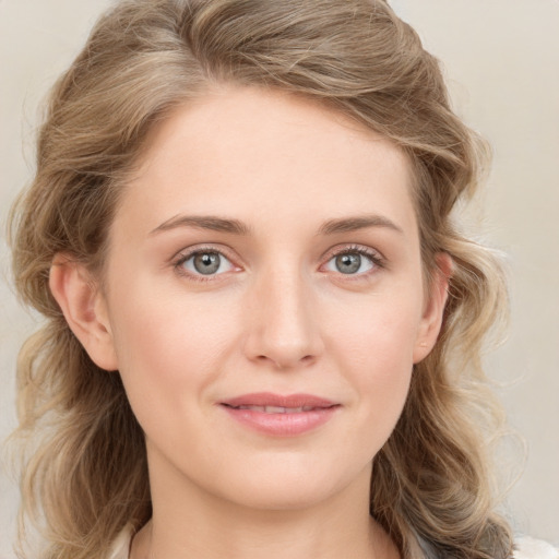 Joyful white young-adult female with medium  brown hair and blue eyes