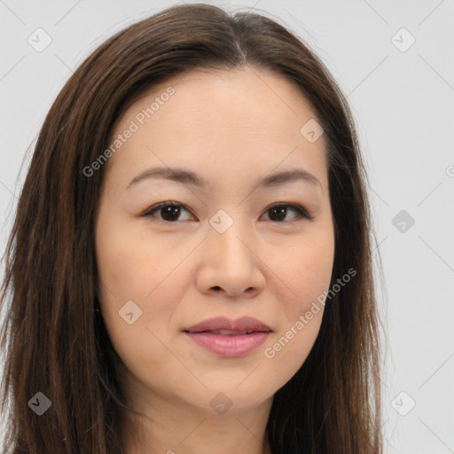 Joyful asian young-adult female with long  brown hair and brown eyes