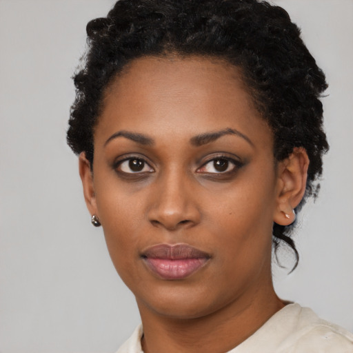 Neutral black young-adult female with short  black hair and brown eyes